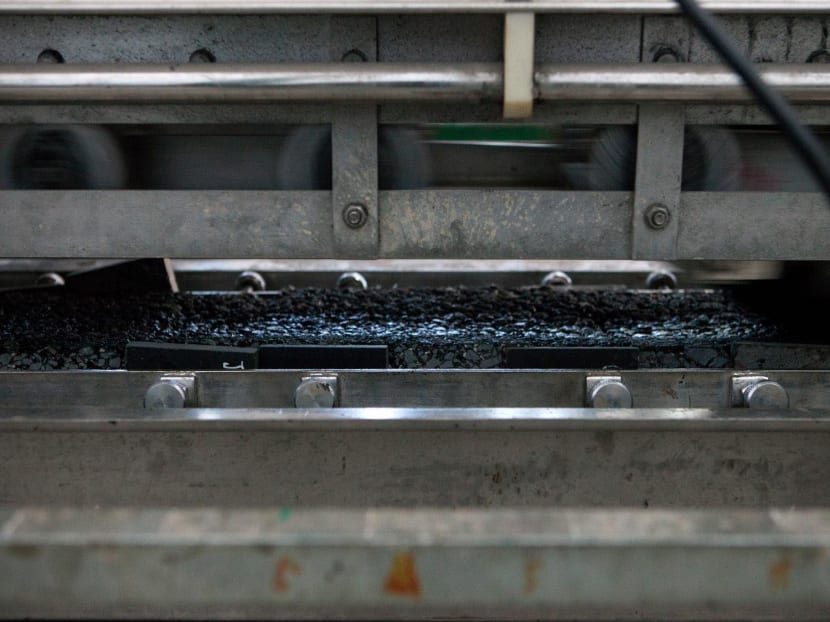 Solar road panels, shown undergoing tests, would likely need to be replaced less often than asphalt roads. But it remains uncertain whether they would be able to take the pounding of millions of tires each year for more than a decade.