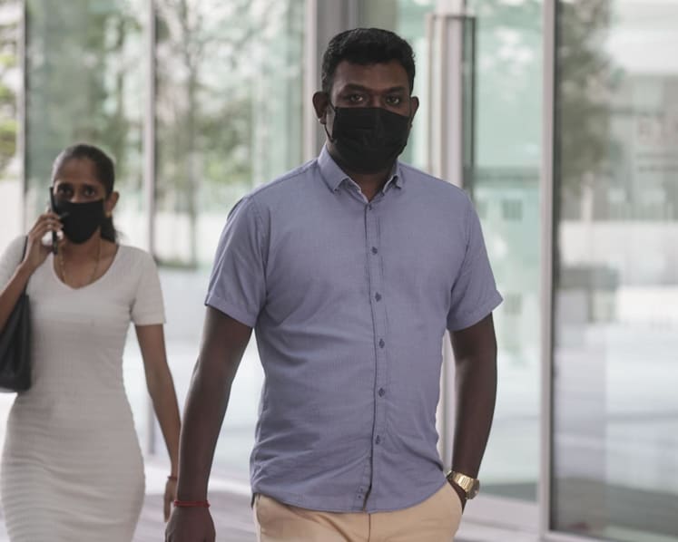 Woman who made construction workers hold up placards demanding payment fined, along with husband