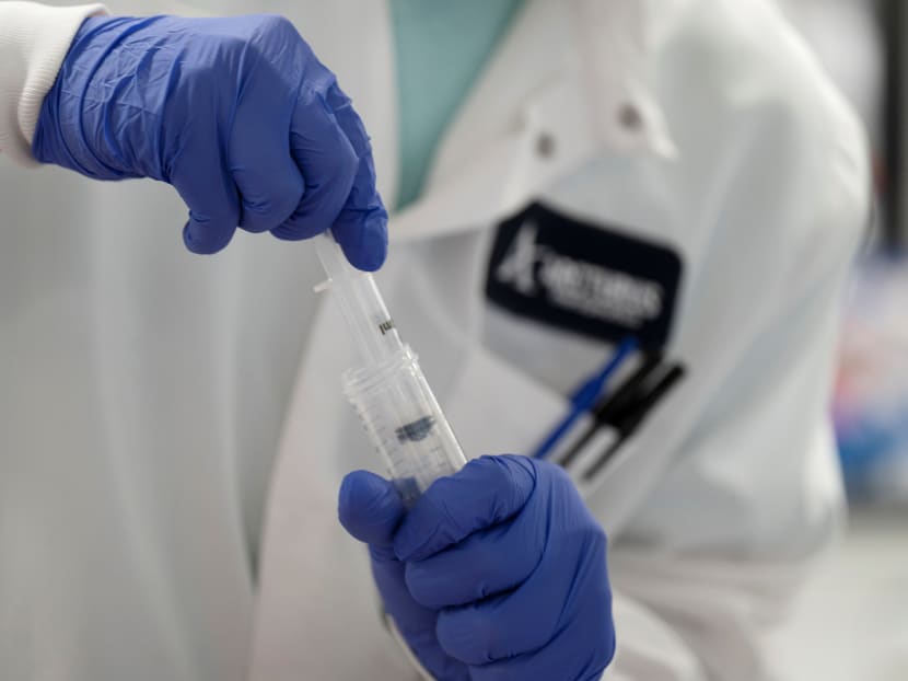 A scientist conducts research on a vaccine for the coronavirus at the laboratories of American pharmaceutical company Arcturus Therapeutics in San Diego, California on March 17, 2020. A scientist conducts research on a vaccine for the coronavirus at the laboratories of American pharmaceutical company Arcturus Therapeutics in San Diego, California on March 17, 2020.