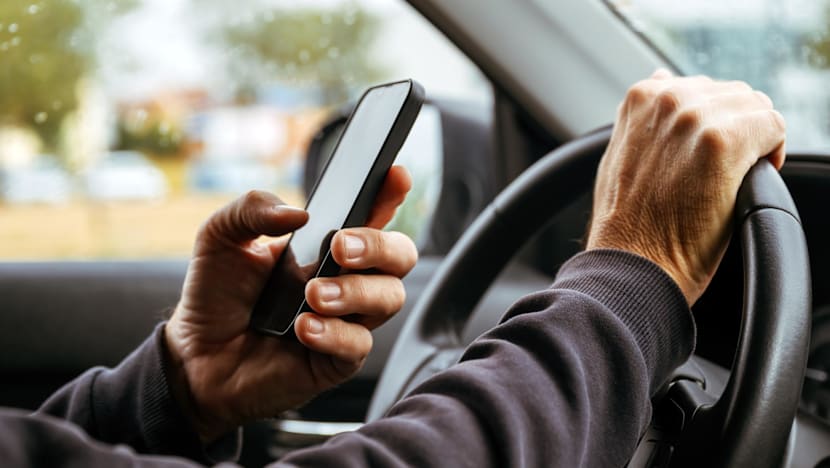 MPs raise concerns over mounted devices, private-hire drivers as law passed to criminalise holding phones while driving