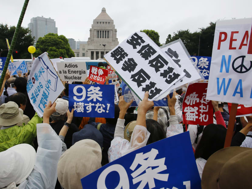 Tens of thousands protest defence bills outside Japan’s parliament