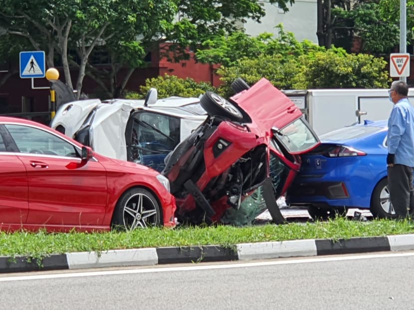 In dashcam videos circulating on private messaging apps, a red car can be seen rear-ending a white car. The red car then overturned on the road.