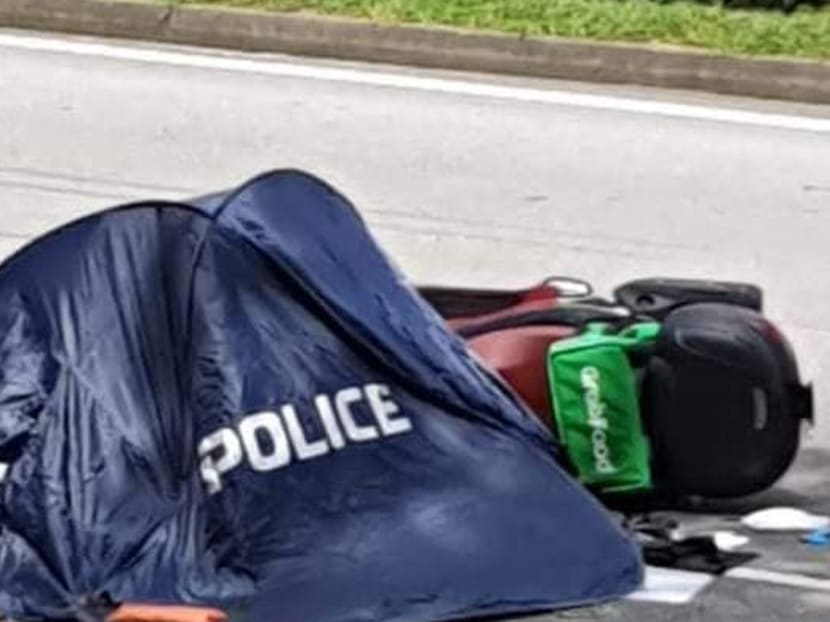 Photos of the incident that have made the rounds on social media show a motorcycle with a GrabFood delivery bag attached to it lying on the side of the road, and a police tent nearby. Photos of the incident that have made the rounds on social media show a motorcycle with a GrabFood delivery bag attached to it lying on the side of the road, and a police tent nearby.