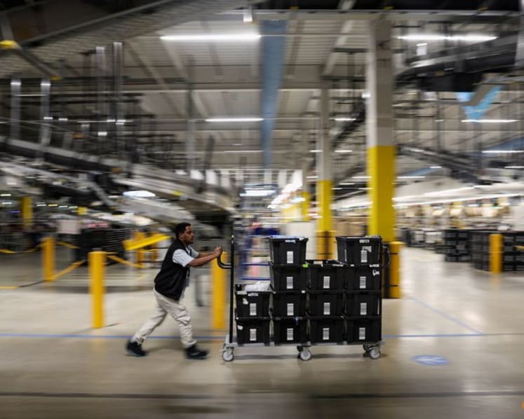 Amazon unveils new AI warehouse robot in $12 billion Europe push