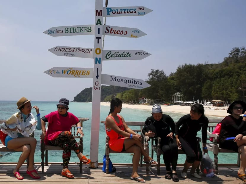 Tourists relaxing on the beaches of Phuket.