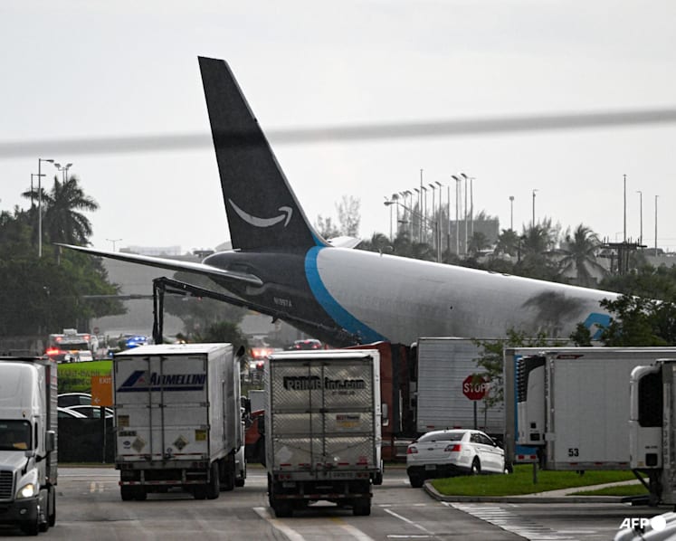 Amazon cargo plane overshoots Miami runway, hits vehicles, catches fire