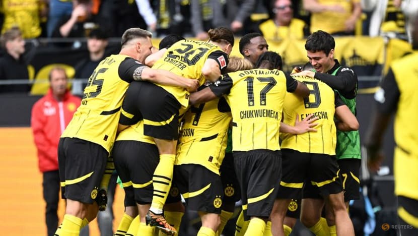 Dortmund snatch last Champions League spot with win over Kiel in season finale
