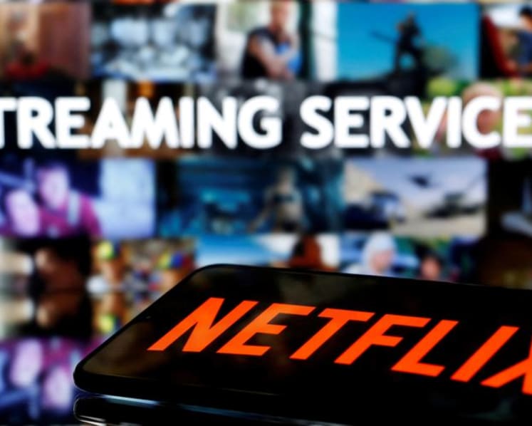 Commentary: Netflix is taking a necessary risk in tackling its 100 million freeloaders