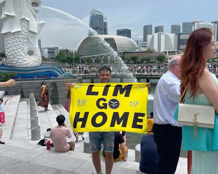 Stern warning for Spanish couple under Singapore police probe for protest against Valencia owner Peter Lim