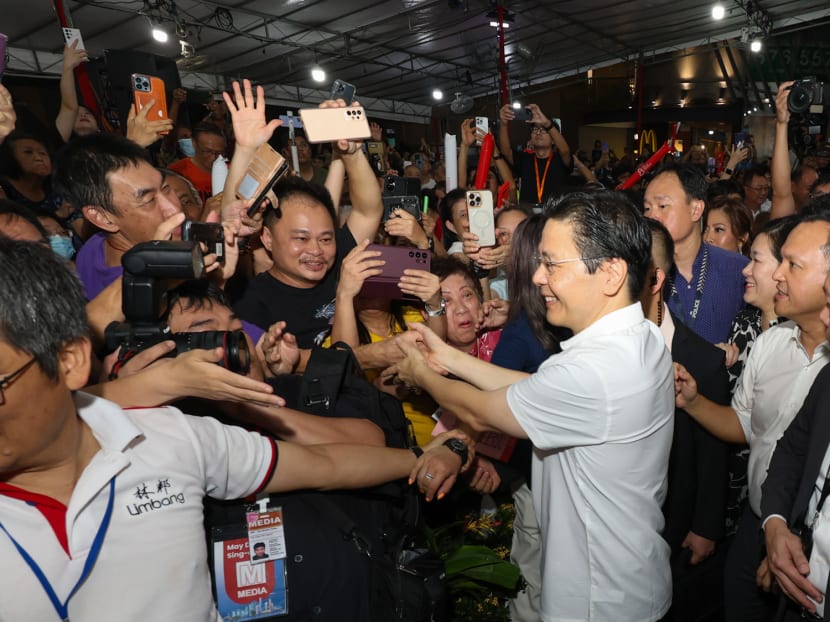 A jubilant crowd of residents greeting and shaking hands with Prime Minister Lawrence Wong at a viewing party in Yew Tee on May 15, 2024. A jubilant crowd of residents greeting and shaking hands with Prime Minister Lawrence Wong at a viewing party in Yew Tee on May 15, 2024.