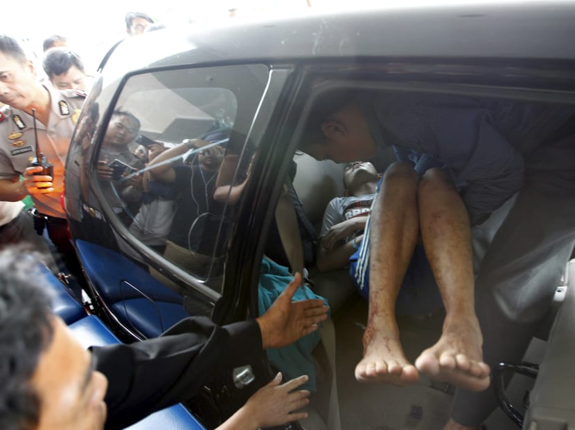 Seven dead in Jakarta blasts, gunfight