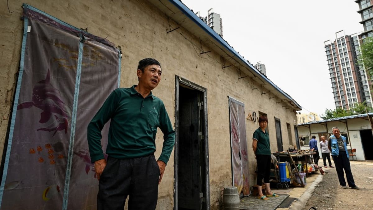 China signals it will relax household registration restrictions