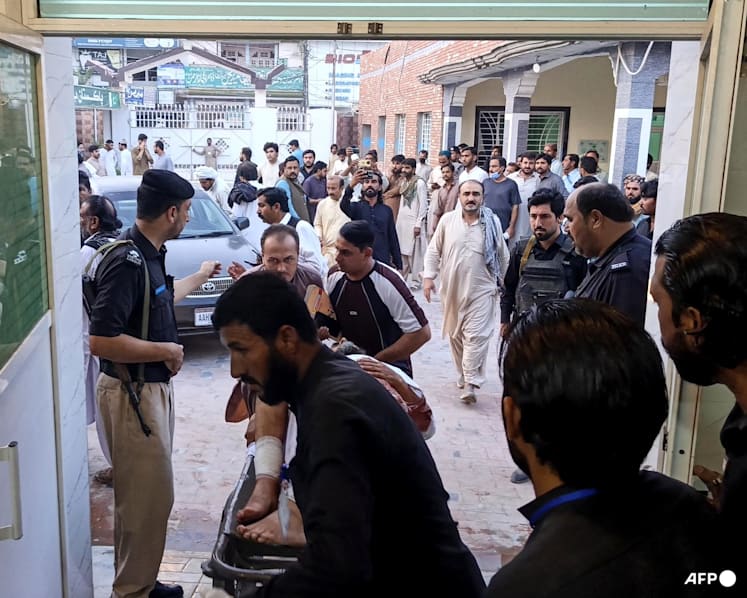 Gunmen target ambulance in Pakistan after suicide bombing at checkpoint killed 12 Gunmen target ambulance in Pakistan after suicide bombing at checkpoint killed 12