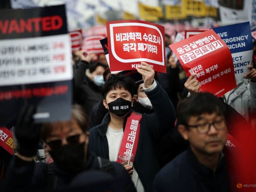 Doctors chant slogans during a rally to protest against government plans to increase medical school admissions in Seoul, South Korea, on March 3, 2024.