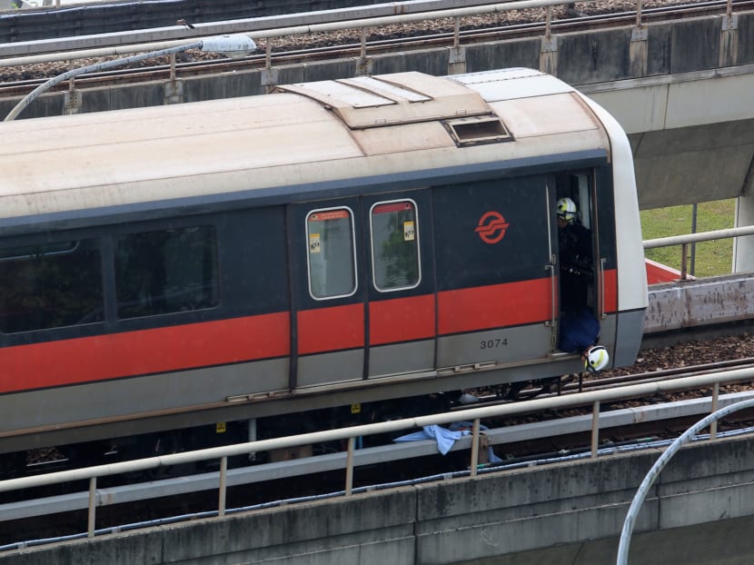 SCDF personnel at the scene of an accident near Pasir Ris Station on March 22, 2016, in which two SMRT maintenance workers were killed . Photo: Koh Mui Fong/TODAY