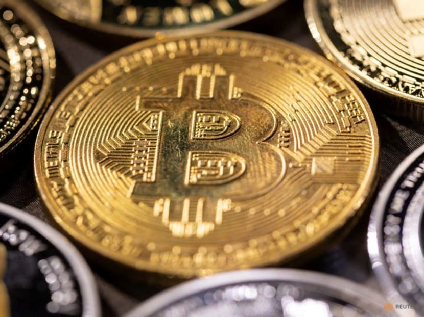 Lin Mingzhong used his credit card to buy S$31,472 worth of bitcoin on eToro.