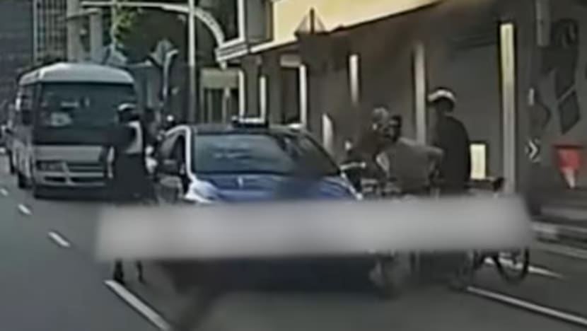 Police investigating after near-collision between cyclists, taxi on Middle Road leads to confrontation Police investigating after near-collision between cyclists, taxi on Middle Road leads to confrontation
