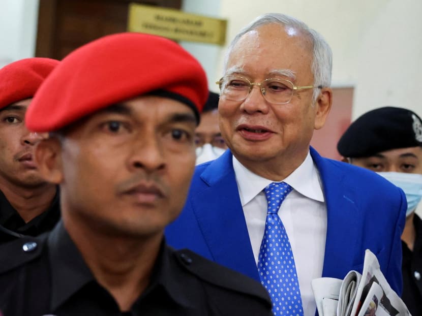 Former Malaysian Prime Minister Najib Razak is escorted by prison officers as the jailed politician leaves the court in Kuala Lumpur, Malaysia on Jan 19, 2024.