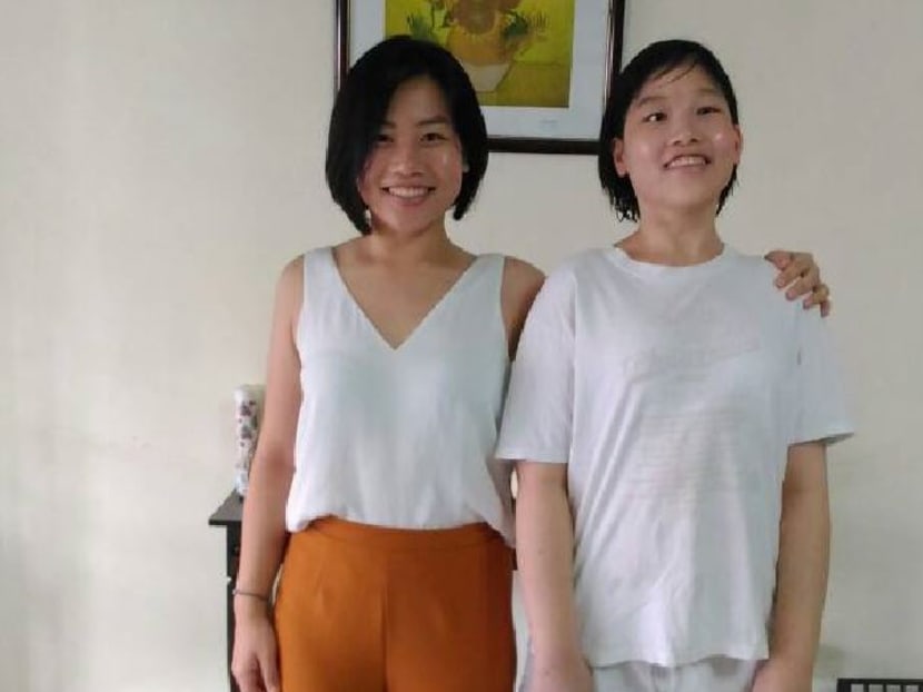 Ms Sharmaine Wang, 25, (right) and her twin Sharlene. Ms Sharmaine Wang had a growth hormone deficiency and was significantly shorter than her sister when they were growing up, but with treatment, she has caught up and is now 2cm taller at 1.67m. Photo courtesy Vivian Lim