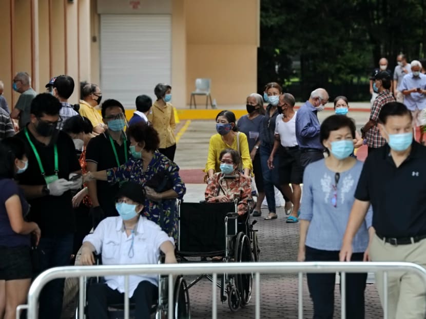 Long queues of people waiting to cast their votes at Henry Park Primary School polling station on July 10, 2020.