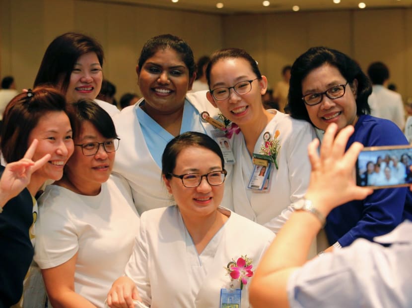 Award recipients taking a photos together with their colleagues at the Nurses Award Ceremony held at Marriott Tang Plaza Hotel. Photo: Najeer Yusof/TODAY