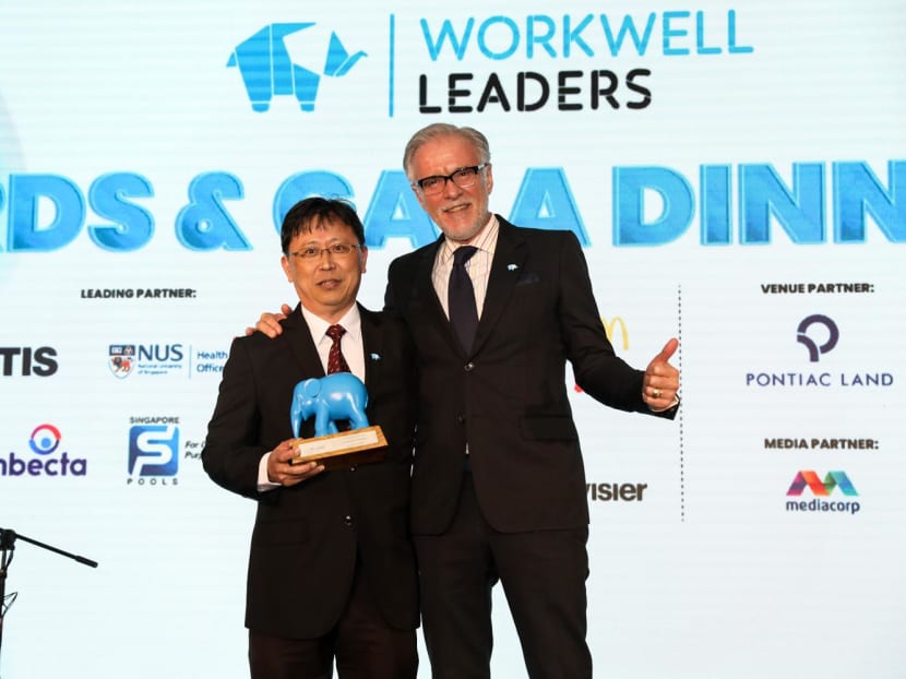 Mr Goh Teck Chin (left), assistant vice-president of PSA, received the Wellbeing Innovation Award on behalf of PSA Corporation at the WorkWell Leaders Awards ceremony on March 14, 2024. With him was Mr Stephane De Montlivault, president of Otis International Asia Pacific, which won the Wellbeing Organisation of the Year Award.