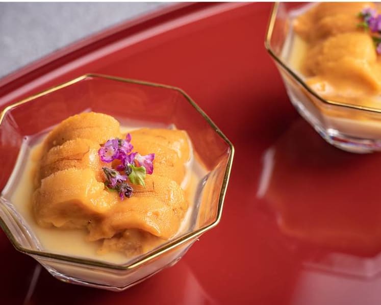 Which new Japanese dining hotspot in Singapore is booked out until August?