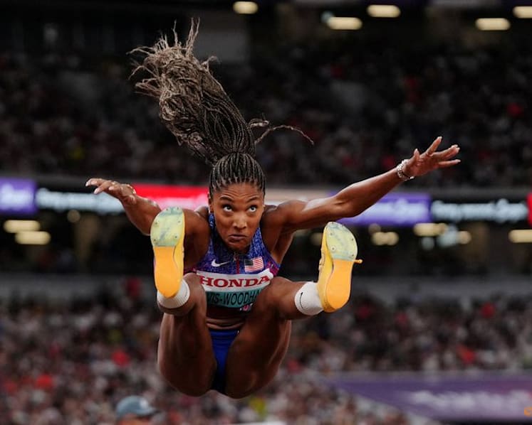 Davis-Woodhall adds world long jump title to Olympic crown