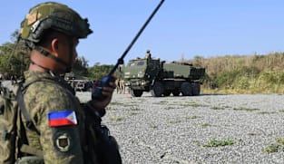 Philippines says two US citizens among 19 killed in raid