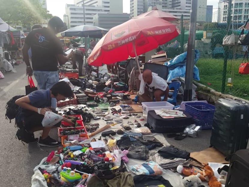 Mr Erei Chua shops for parts from a vendor at the Sungei Road Thieves' Market. Photo: Low Youjin/TODAY