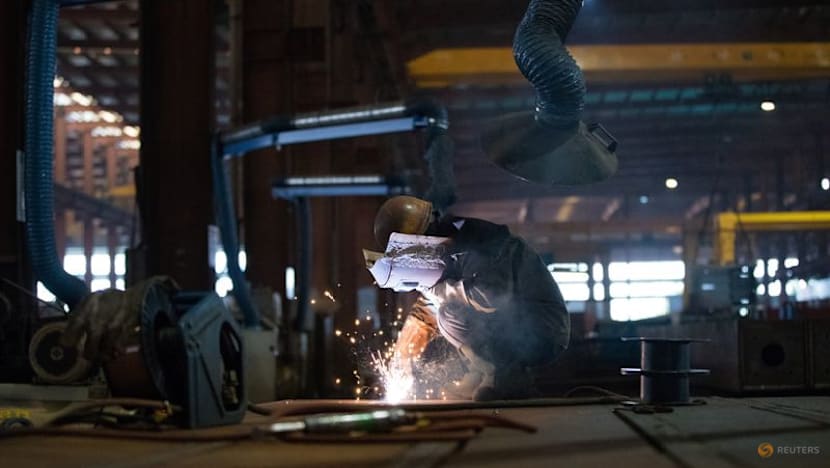 China's factory activity returns to growth in December, ending eight months of decline