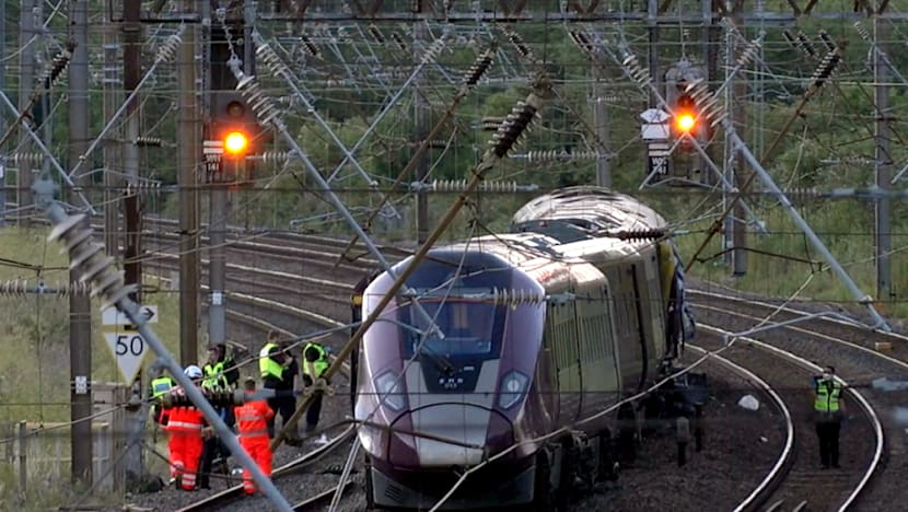Driver killed in UK train collision passed red signal: investigators