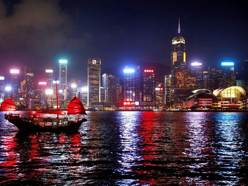 A junk boat passes the skyline as seen from the Tsim Sha Tsui waterfront in Hong Kong. Bookings for Golden Week in October, China’s biggest public holiday, had filled less than 30 per cent of hotel rooms on average across the city, compared with 60 per cent around this time in previous years.