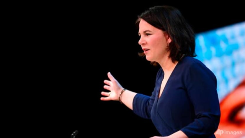 German contender wants tougher stance on China, Russia