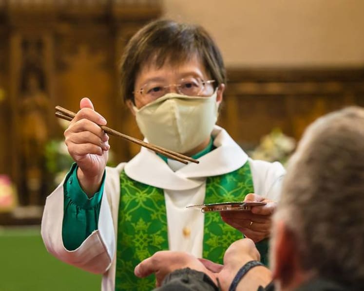 UK-based Singaporean priest goes global after giving Communion with 'lo hei' chopsticks