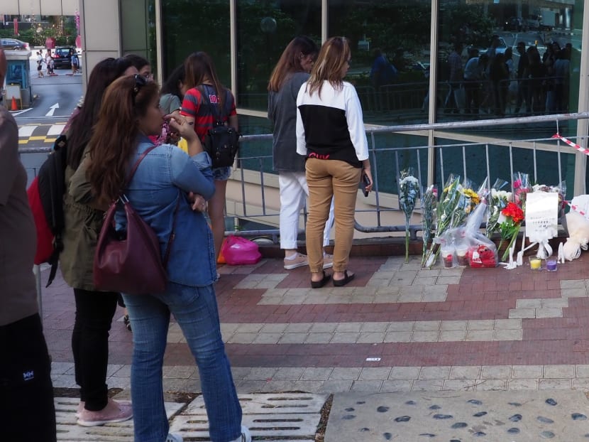 On Dec 30, 2019, onlookers mill around the Lucky Plaza site where a car crash killed two women and injured four. On Dec 30, 2019, onlookers mill around the Lucky Plaza site where a car crash killed two women and injured four.