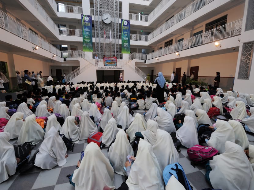 Madrasah students are seen on January 29, 2009 during assembly before class start at Madrasah Al-Irsyad Al-Islamiah in Singapore. AFP file photo