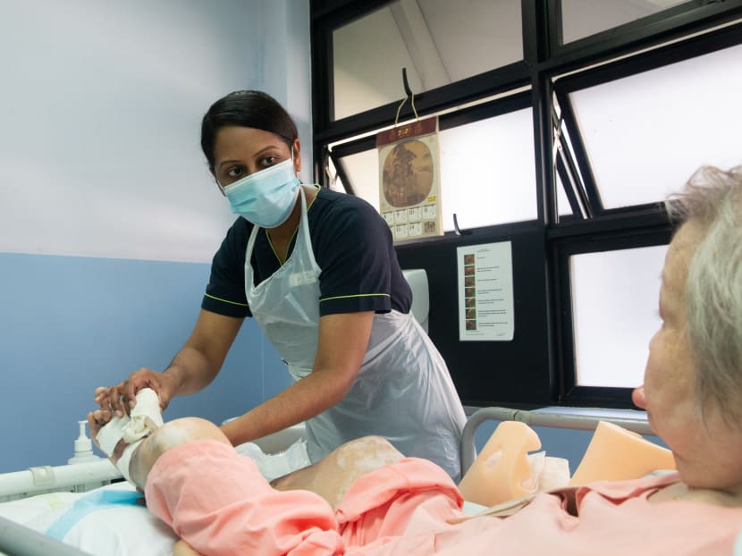 Ms Kavitha Sanmugam, an advance practice nurse, caring for a patient in St Luke’s Hospital.