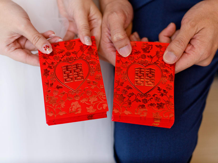 Red packets are traditionally given as tokens of good wishes during Chinese weddings. Red packets are traditionally given as tokens of good wishes during Chinese weddings.