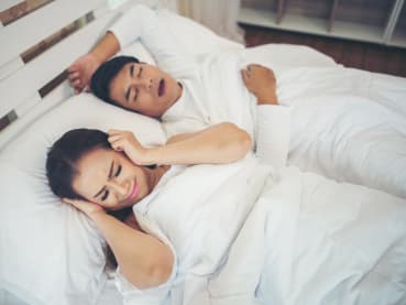 My partner snores. How can I get some sleep and wake up rested?