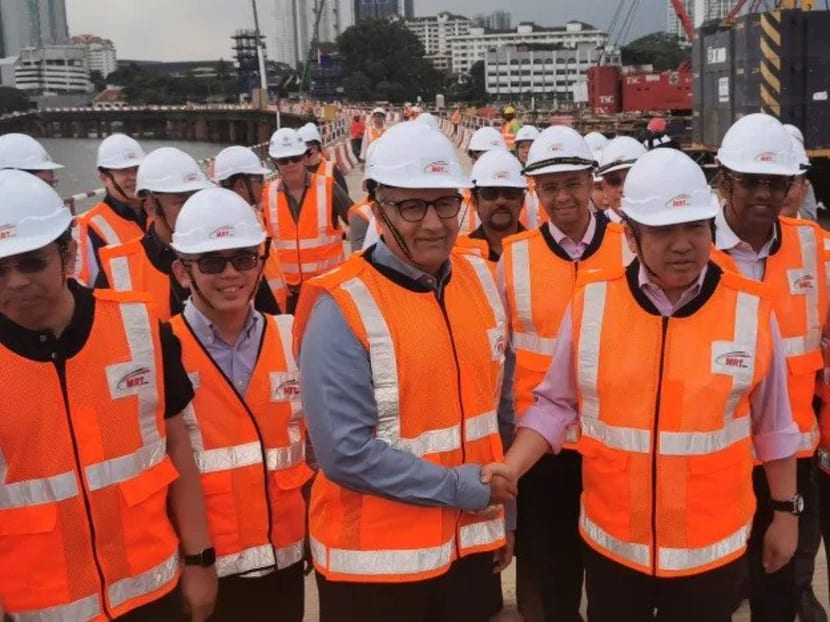 Singapore Transport Minister S Iswaran (third from left) and his Malaysian counterpart Anthony Loke during a visit to the JB-Singapore RTS Link project marine viaduct. Singapore Transport Minister S Iswaran (third from left) and his Malaysian counterpart Anthony Loke during a visit to the JB-Singapore RTS Link project marine viaduct.