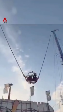 2 children rescued after slingshot ride at Spain fair snaps