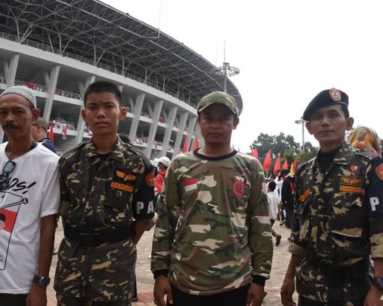 Election enforcers: Paramilitary groups for Jokowi and Prabowo flex their muscles at rallies