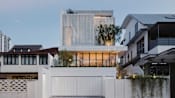 Behind the mysterious white facade of this Singapore house lies a warm, light-filled home