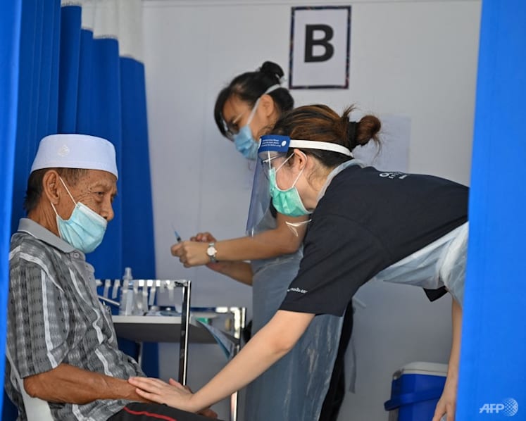 Malaysia's health frontliners, elderly to get COVID-19 booster shots once 80% of adults are vaccinated