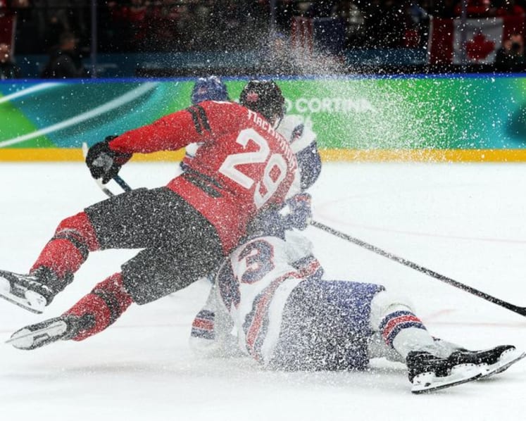 Ice hockey-US claim long-awaited gold by beating rivals Canada in overtime thriller