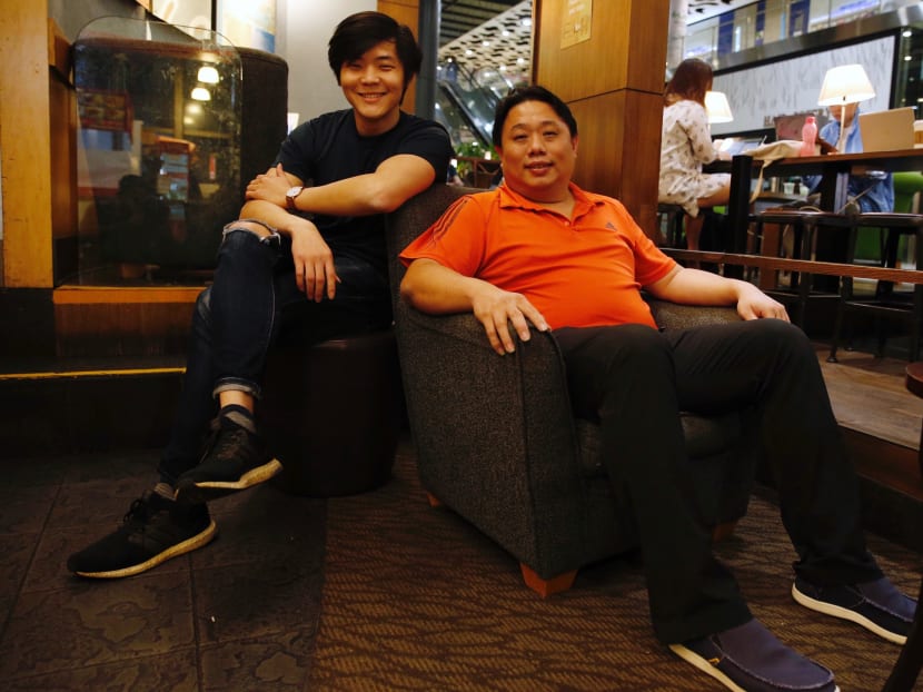 Mr Tan Wang Ren with his mentor and former teacher Ng Chee Keong, who lent him S$13,000 to pay for his flat.