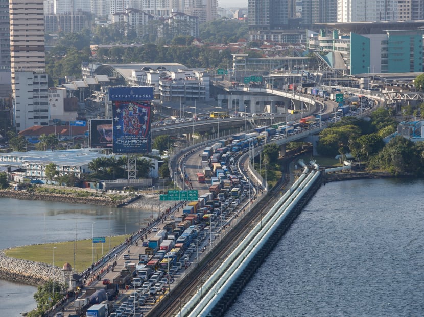The traffic jam on the Woodlands Causeway in the direction towards Singapore seen on Tuesday (March 17, 2020) at 5:45pm. Prime Minister Lee Hsien Loong said the flow of goods and cargo will be allowed between Singapore and Malaysia during the latter’s nationwide lockdown. The traffic jam on the Woodlands Causeway in the direction towards Singapore seen on Tuesday (March 17, 2020) at 5:45pm. Prime Minister Lee Hsien Loong said the flow of goods and cargo will be allowed between Singapore and Malaysia during the latter’s nationwide lockdown.