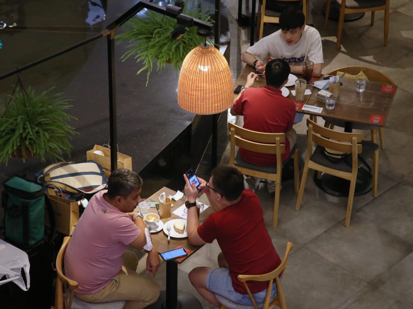 Diners at a restaurant in Raffles City Shopping Centre on July 20, 2021.