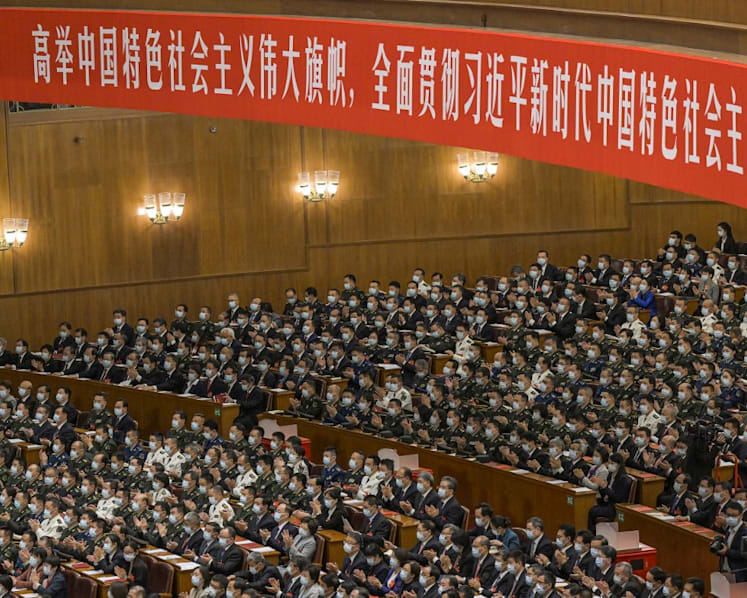 How is China's Communist Party changing its constitution?